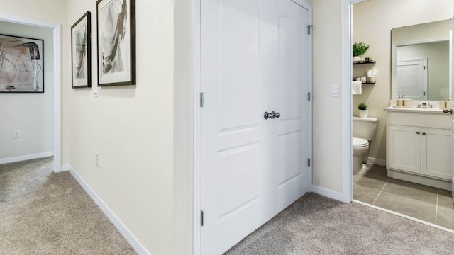 2424 Penguin Blvd, Davenport, FL 33837 - bathroom with vanity and carpet flooring