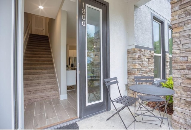 2113 Broome St, Kissimmee, FL 34743 - property entrance featuring stucco siding and stone siding