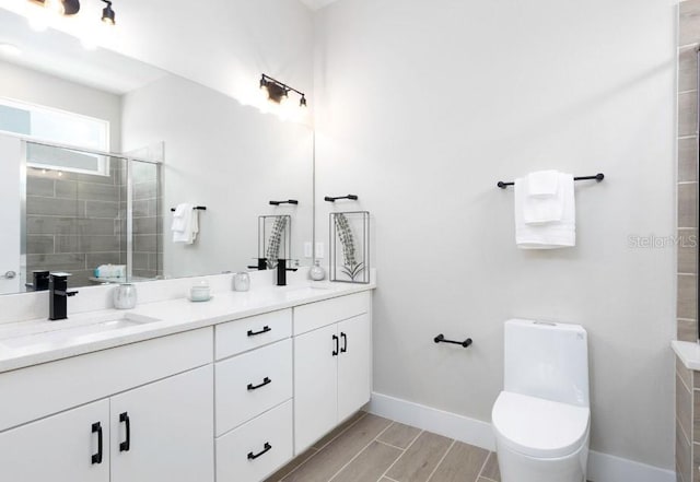 2113 Broome St, Kissimmee, FL 34743 - bathroom featuring double vanity, a stall shower, and wood tiled floors