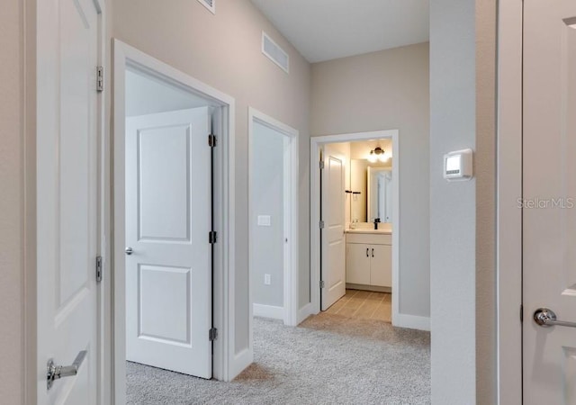2113 Broome St, Kissimmee, FL 34743 - corridor featuring light colored carpet and baseboards