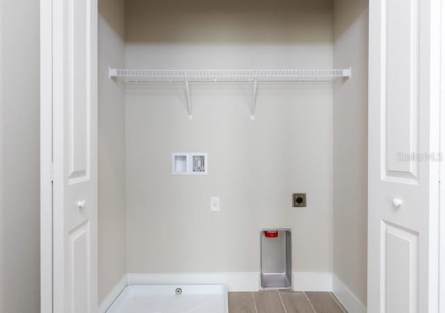2113 Broome St, Kissimmee, FL 34743 - washroom featuring hookup for an electric dryer and washer hookup