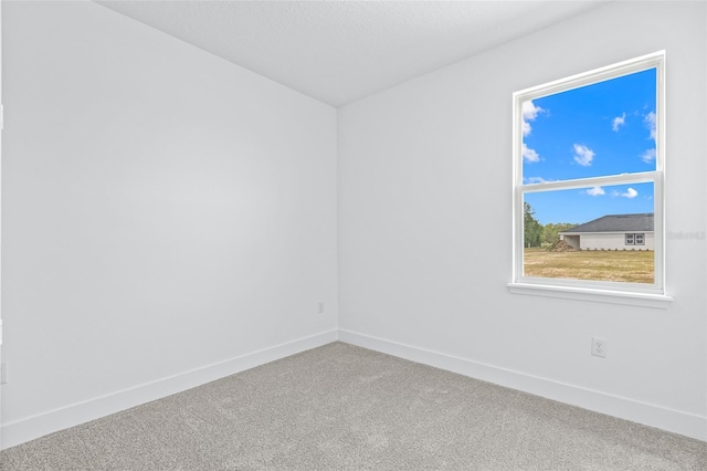 1261 Champions Dr, Daytona Beach, FL 32124 - carpeted spare room featuring baseboards