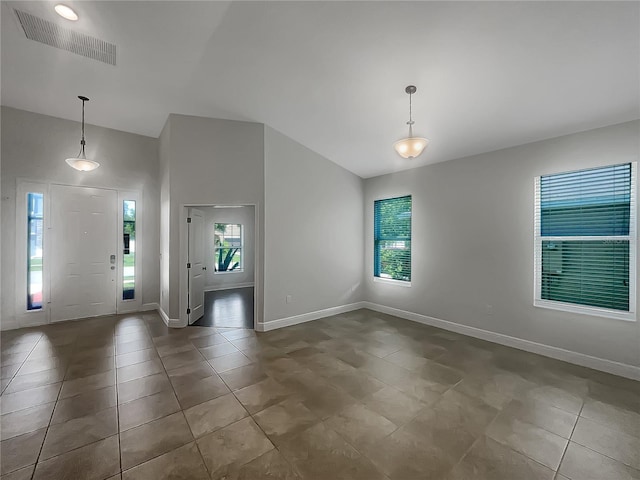 12671 Flatwood Creek Dr, Gibsonton, FL 33534 - tiled empty room featuring vaulted ceiling and baseboards