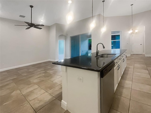 12671 Flatwood Creek Dr, Gibsonton, FL 33534 - kitchen featuring stainless steel dishwasher, dark countertops, a ceiling fan, light tile patterned floors, and white cabinetry
