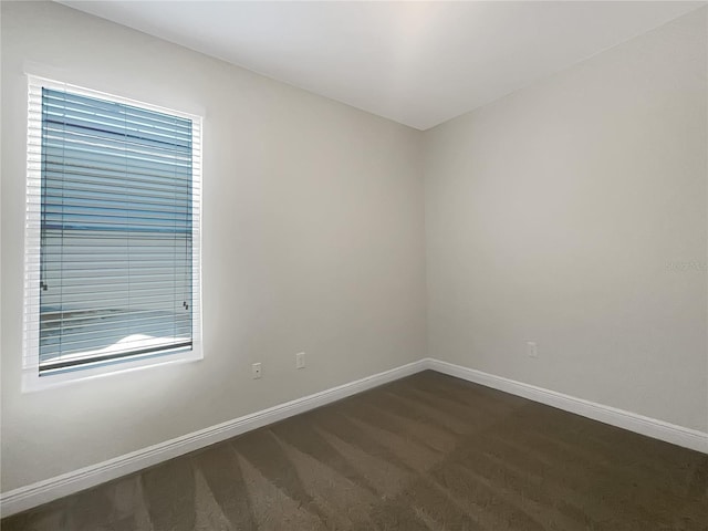 12671 Flatwood Creek Dr, Gibsonton, FL 33534 - unfurnished room with baseboards and dark colored carpet