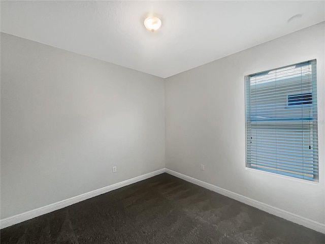 12671 Flatwood Creek Dr, Gibsonton, FL 33534 - spare room with baseboards and dark carpet