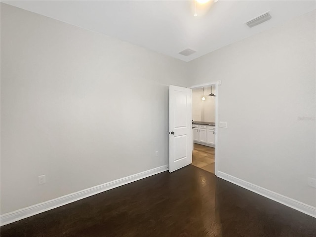 12671 Flatwood Creek Dr, Gibsonton, FL 33534 - empty room with wood finished floors and baseboards