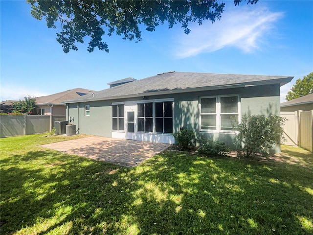 12671 Flatwood Creek Dr, Gibsonton, FL 33534 - back of property with a patio area, stucco siding, a fenced backyard, and a shingled roof