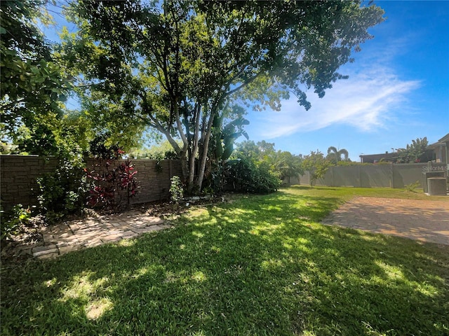 12671 Flatwood Creek Dr, Gibsonton, FL 33534 - fenced backyard featuring a patio