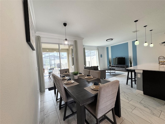 4192 Paragraph Dr, Kissimmee, FL 34746 - dining space with ornamental molding and light marble finish flooring