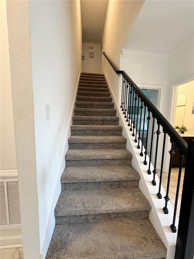 4192 Paragraph Dr, Kissimmee, FL 34746 - stairs with ornamental molding and baseboards