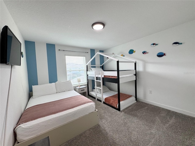 4192 Paragraph Dr, Kissimmee, FL 34746 - carpeted bedroom with a textured ceiling and baseboards