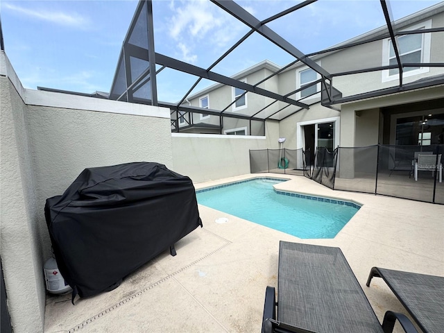 4192 Paragraph Dr, Kissimmee, FL 34746 - view of swimming pool with a patio area, grilling area, and glass enclosure