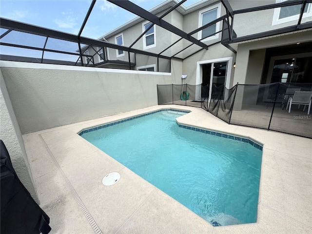 4192 Paragraph Dr, Kissimmee, FL 34746 - view of swimming pool featuring a patio and glass enclosure