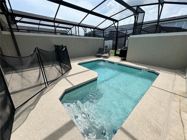 4192 Paragraph Dr, Kissimmee, FL 34746 - swimming pool with a patio area and glass enclosure