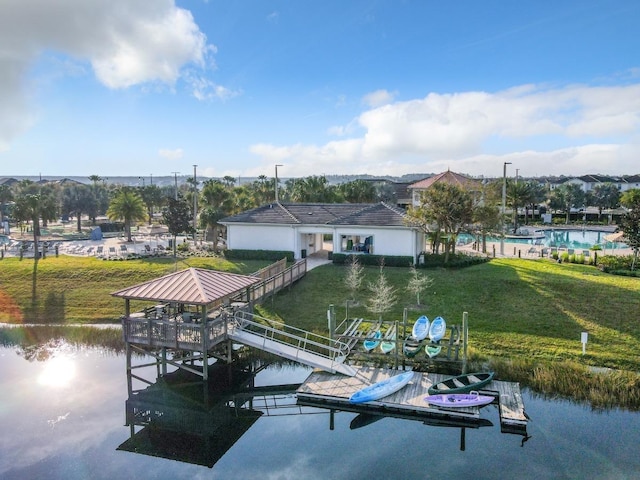 4192 Paragraph Dr, Kissimmee, FL 34746 - dock with a yard and a water view