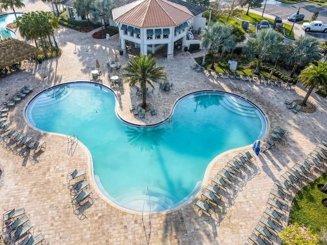 4192 Paragraph Dr, Kissimmee, FL 34746 - community pool featuring a patio area
