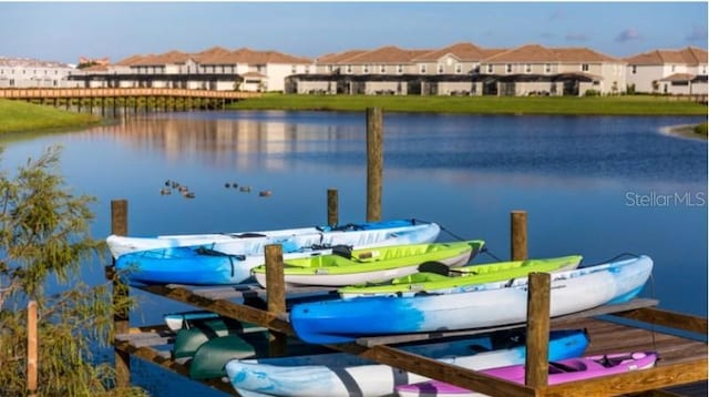 4192 Paragraph Dr, Kissimmee, FL 34746 - dock area featuring a water view and a residential view