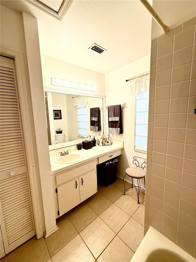 9803 Terrace Trail Ln, Temple Terrace, FL 33637 - bathroom with tile patterned flooring, vanity, a tub, and a shower