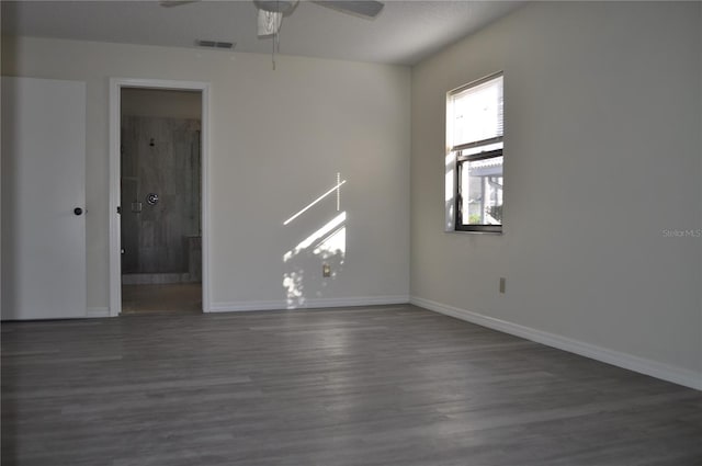 721 Elkhorn Rd, Sun City Center, FL 33573 - unfurnished room with ceiling fan and dark wood finished floors