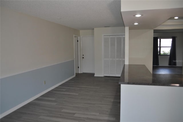 721 Elkhorn Rd, Sun City Center, FL 33573 - kitchen featuring wood finished floors, recessed lighting, dark countertops, and a textured ceiling