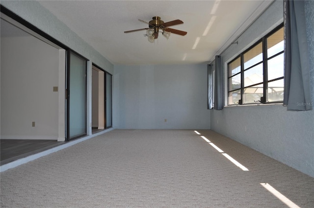 721 Elkhorn Rd, Sun City Center, FL 33573 - carpeted spare room with ceiling fan