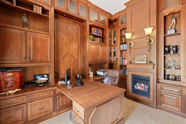 11209 Macaw Ct, Windermere, FL 34786 - home office featuring built in study area, built in shelves, and a glass covered fireplace
