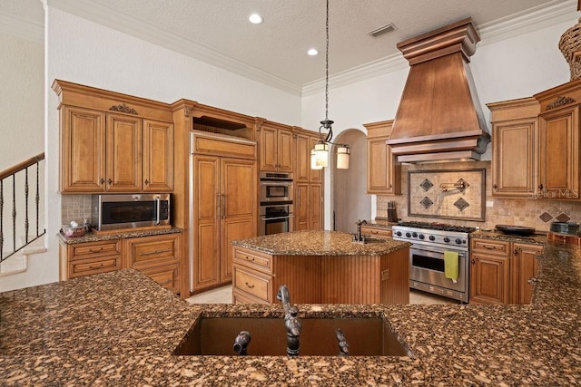 11209 Macaw Ct, Windermere, FL 34786 - kitchen featuring premium appliances, open shelves, decorative backsplash, dark stone countertops, and a kitchen island