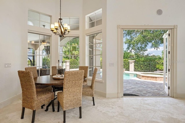11209 Macaw Ct, Windermere, FL 34786 - dining area featuring a chandelier and a high ceiling