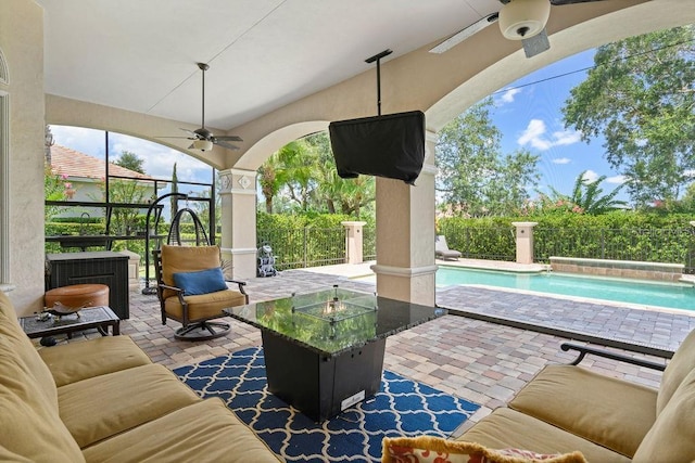 11209 Macaw Ct, Windermere, FL 34786 - view of patio with ceiling fan, an outdoor pool, and an outdoor living space with a fire pit