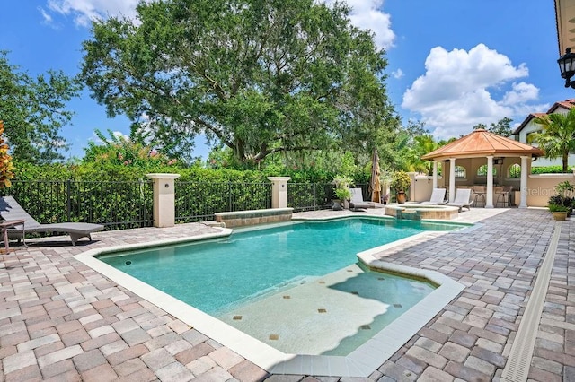 11209 Macaw Ct, Windermere, FL 34786 - view of pool with a gazebo, a patio area, and a pool with connected hot tub