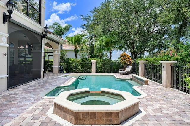 11209 Macaw Ct, Windermere, FL 34786 - view of swimming pool featuring a pool with connected hot tub and a patio