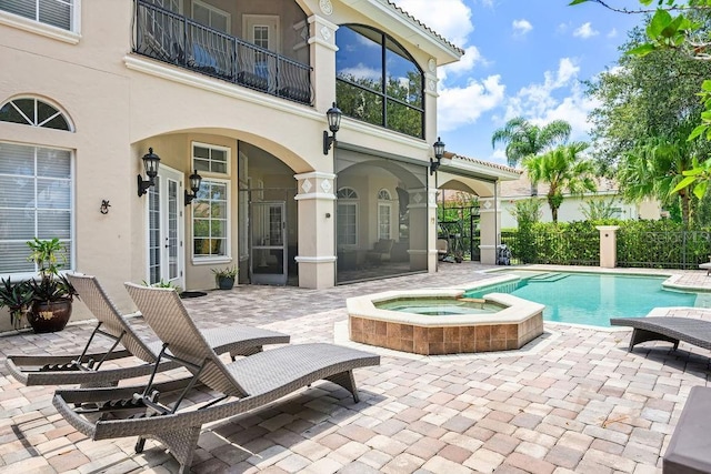 11209 Macaw Ct, Windermere, FL 34786 - view of swimming pool featuring a patio and a pool with connected hot tub