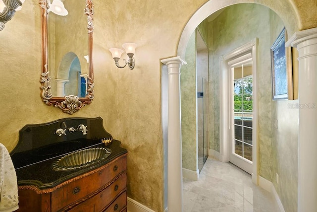 11209 Macaw Ct, Windermere, FL 34786 - bathroom with decorative columns and baseboards