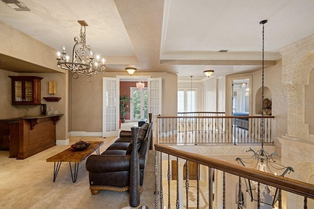 11209 Macaw Ct, Windermere, FL 34786 - sitting room featuring a chandelier, arched walkways, and an upstairs landing