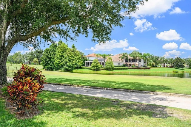 11209 Macaw Ct, Windermere, FL 34786 - view of community featuring a water view and a lawn