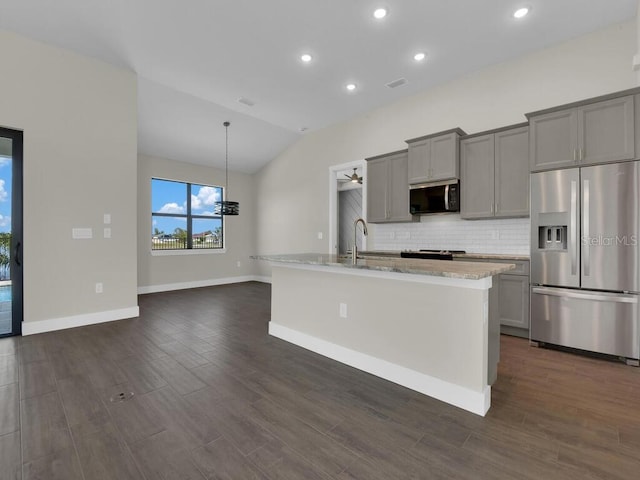 10381 Rainsville St, Port Charlotte, FL 33981 - kitchen with gray cabinetry, stainless steel appliances, backsplash, vaulted ceiling, and dark wood-type flooring