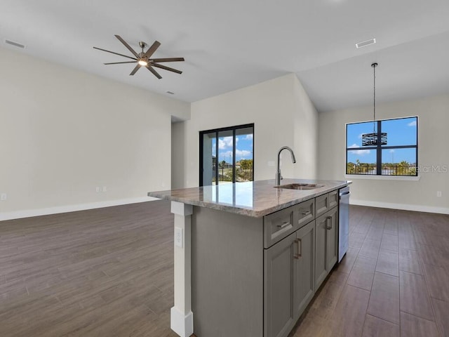 10381 Rainsville St, Port Charlotte, FL 33981 - kitchen with open floor plan, gray cabinets, plenty of natural light, and dark wood-type flooring