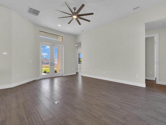 10381 Rainsville St, Port Charlotte, FL 33981 - unfurnished living room with ceiling fan, dark wood finished floors, french doors, and recessed lighting