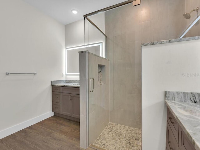 10381 Rainsville St, Port Charlotte, FL 33981 - bathroom featuring a shower stall, wood finished floors, vanity, and recessed lighting