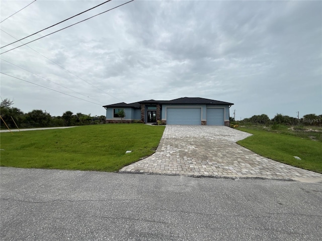 10381 Rainsville St, Port Charlotte, FL 33981 - view of front of property with decorative driveway, a garage, a front lawn, and stone siding