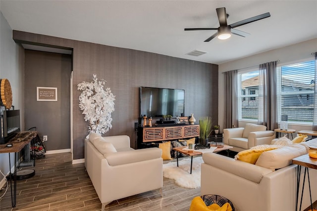 6992 Dilly Lake Ave, Groveland, FL 34736 - living area with wallpapered walls, a ceiling fan, wood finish floors, and an accent wall