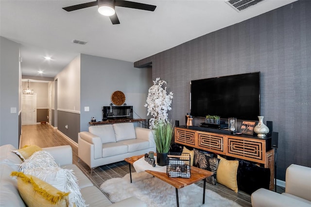 6992 Dilly Lake Ave, Groveland, FL 34736 - living room featuring a ceiling fan, wood finished floors, recessed lighting, and an accent wall