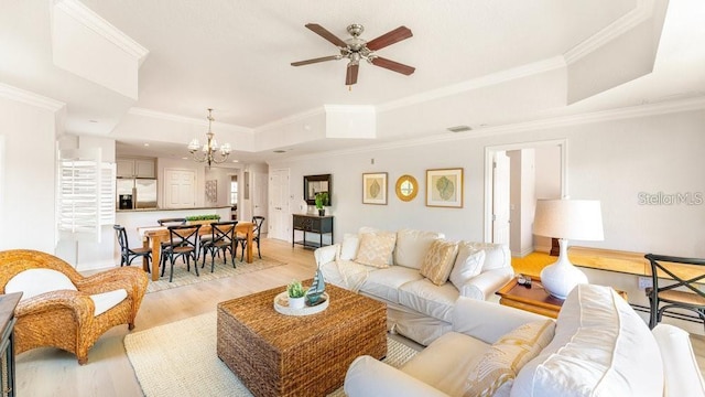 7650 Whisper Way Unit 304, Reunion, FL 34747 - living area with a raised ceiling, ceiling fan, light wood-style flooring, crown molding, and a chandelier