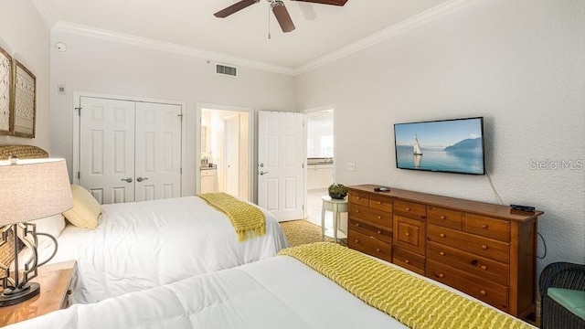 7650 Whisper Way Unit 304, Reunion, FL 34747 - bedroom with ornamental molding, a closet, ensuite bathroom, and ceiling fan