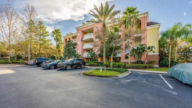7650 Whisper Way Unit 304, Reunion, FL 34747 - view of property with uncovered parking