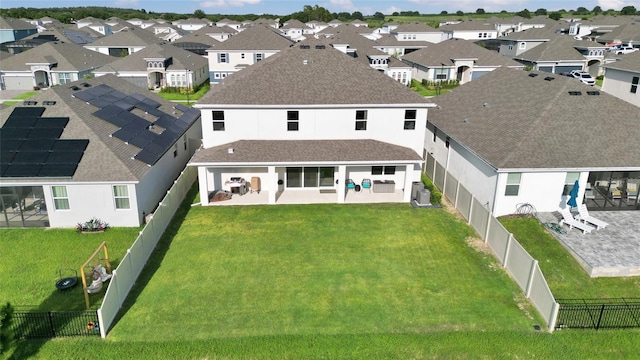 4477 Renly Ln, Clermont, FL 34711 - back of property featuring a patio, a fenced backyard, a residential view, stucco siding, and a shingled roof