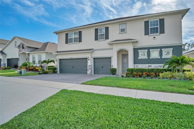 4477 Renly Ln, Clermont, FL 34711 - traditional home featuring stucco siding, a garage, driveway, a front lawn, and stone siding