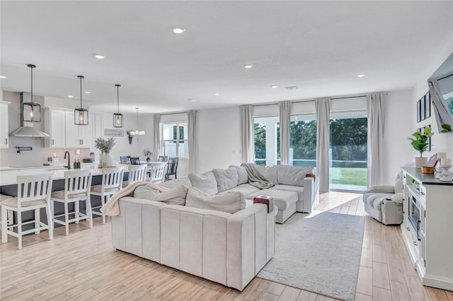 4477 Renly Ln, Clermont, FL 34711 - living room with light wood-style floors and recessed lighting