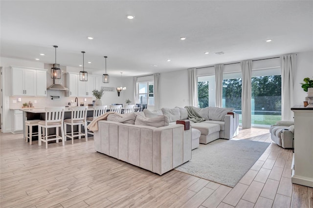 4477 Renly Ln, Clermont, FL 34711 - living area featuring light wood-style floors and recessed lighting